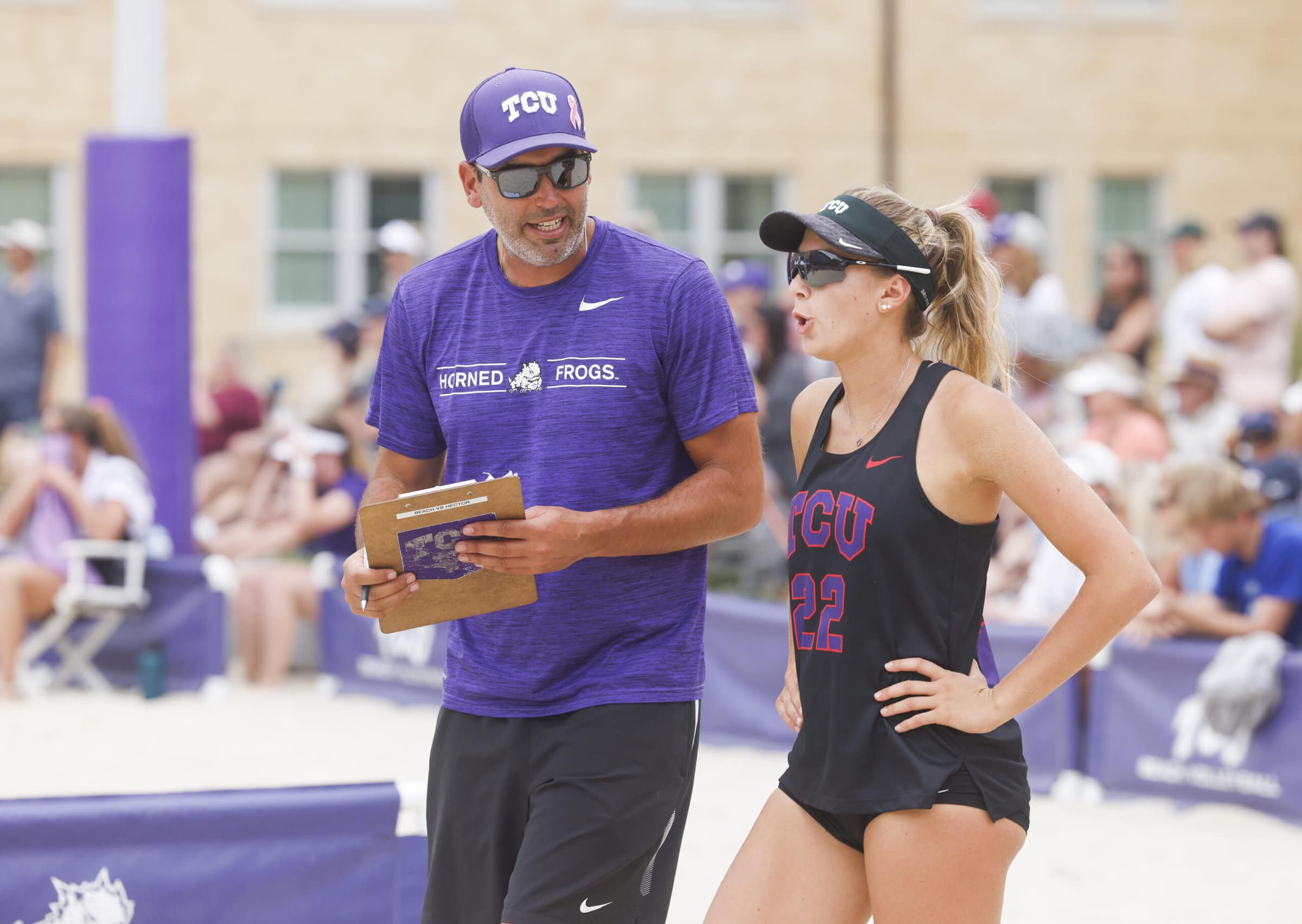 B37 Hector Gutierrez speaking with one of his TCU beach athletes