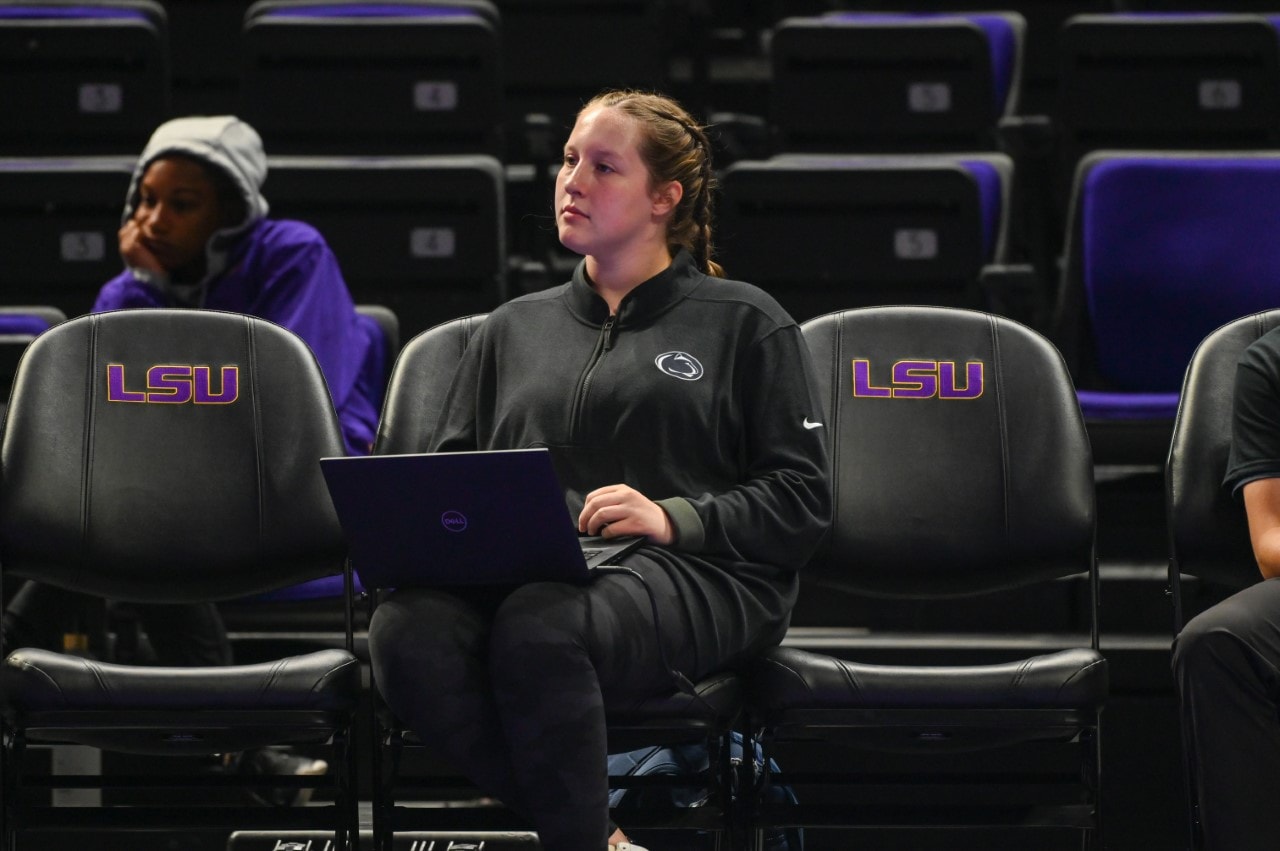 W306 Volleyball coach with laptop at practice